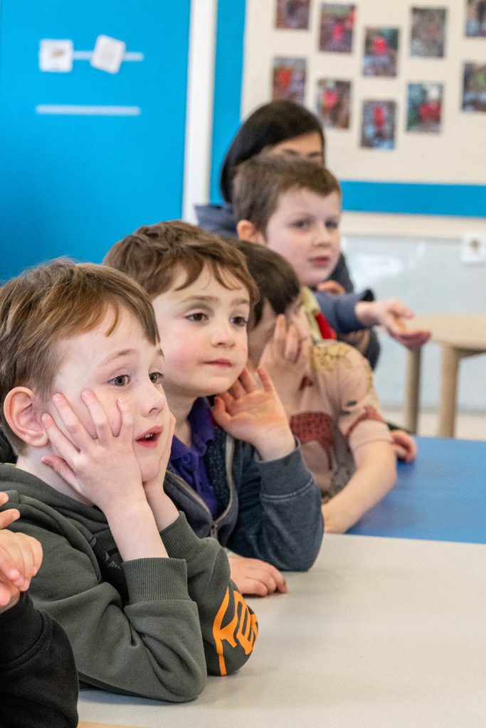 Children In A Line Paying Attention